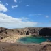 Het baaitje van Papagayo op Lanzarote met licht zand en turquoise water tussen bruine rotsen